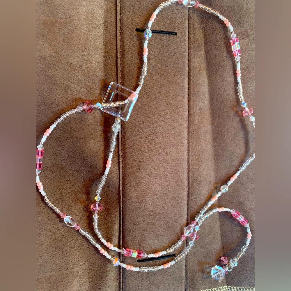 Long adjustable lanyard style necklace. New. Never worn